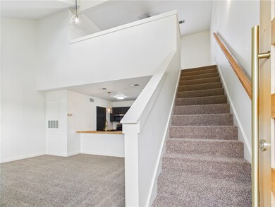 Stairs featuring carpet floors and bar area