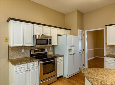 Kitchen with Pantry Door and view to Dining Room
