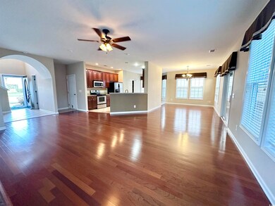 Unfurnished living room featuring dark wood finish