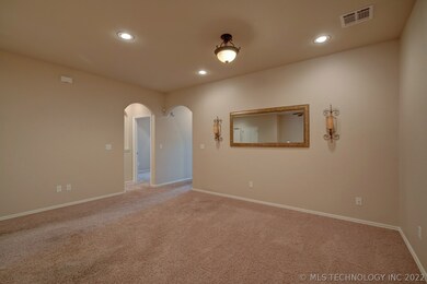View of living room from the entryway.  Arched ent