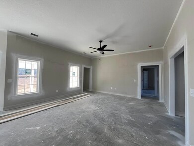 Unfurnished room featuring a textured ceiling, cei