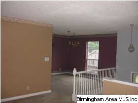 LIVING ROOM AND VIEW OF DINING ROOM