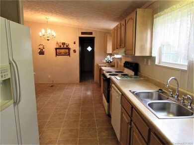 View from the kitchen. Laundry room and door to ou