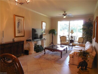 Great room from kitchen.  Tile floor, ceiling fan 