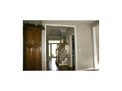 Grand entry with vaulted ceilings and beautiful ha