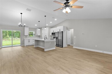 Looking diagonally across the open entertaining area with vaulted ceilings, it looks even bigger in person!