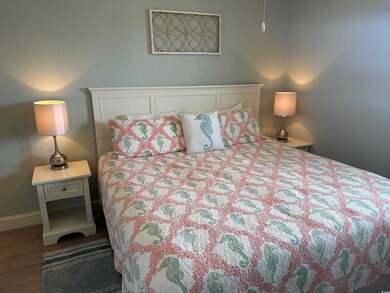 Bedroom with hardwood / wood-style floors