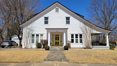 This main entrance with slate sidewalk opens into