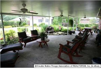 Lovely covered patio with relaxing views of landsc