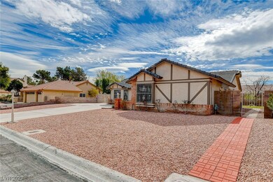 Paved walkway from front yard to the back side yar