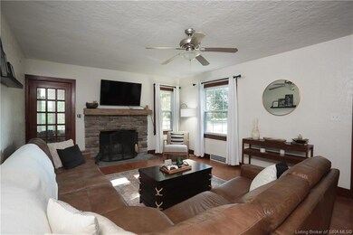 Living Room with Wood Burning Fireplace