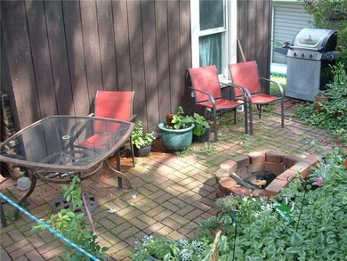 Exterior Back. Ground level brick patio