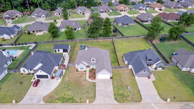 Aerial overview of property's location featuring nearby suburban area