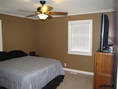 Bedroom features great crown molding and its own half bath.