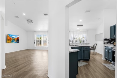 Kitchen with plenty of natural light, wood finishe