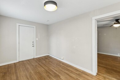 Unfurnished room with ceiling fan and hardwood / w