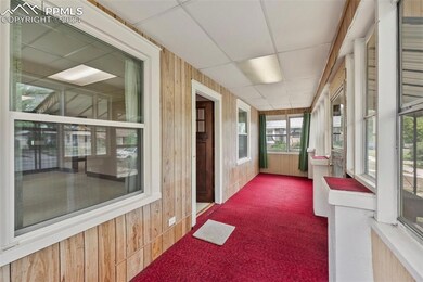 Unfurnished sunroom with a drop ceiling