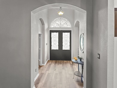 Entryway with light hardwood / wood-style flooring
