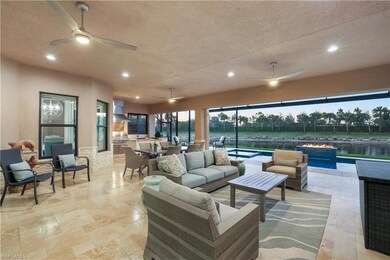 Extended lanai area, features outdoor kitchen, dining, living areas.  Beautiful pool with two fire features.