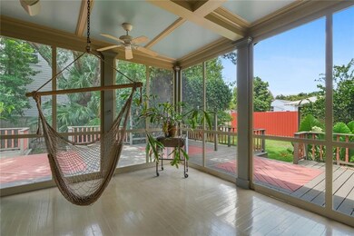 Gorgeous screened in porched showcases the scope o