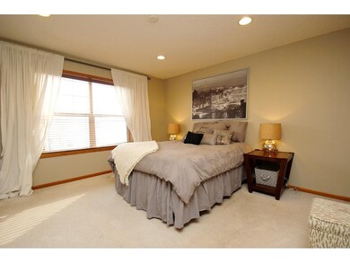 Spacious master bedroom complete with recessed lig