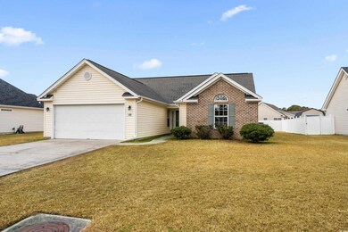 View of front of house featuring a garage and a fr