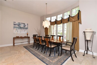 Huge formal dining room accented with a wall of wi