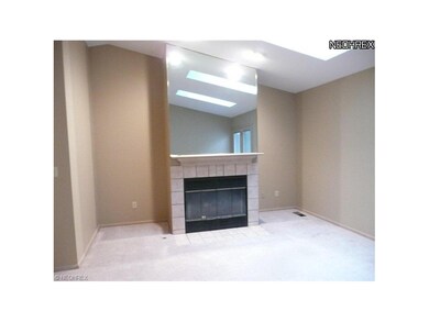 Cozy gas fireplace, custom mirrored wall and mantl