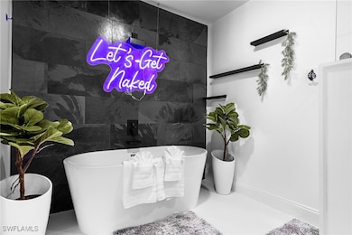Full bathroom with a freestanding bath