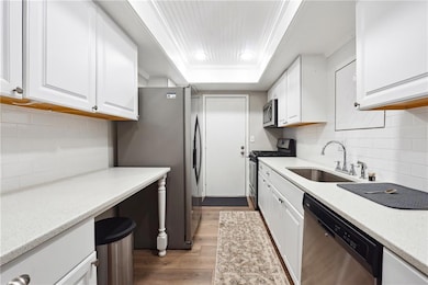 Kitchen with backsplash, stainless steel appliance