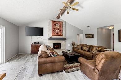 A nice sized family room with cathedral ceilings a
