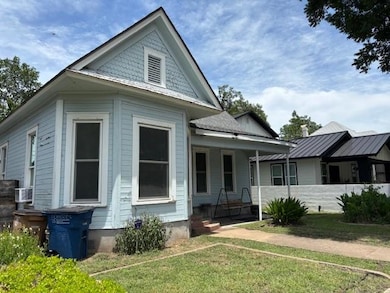 View of front of home featuring a porch and a fro