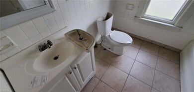 Bathroom with backsplash, mirror, oversized vanity