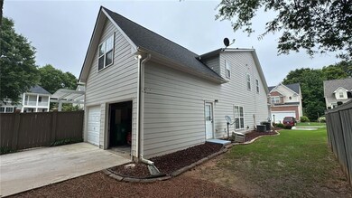 View of home's exterior with an attached garage, driveway, central air condition unit, and roof with shingles