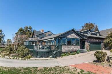 An expansive wraparound deck, sunroom, outdoor sho