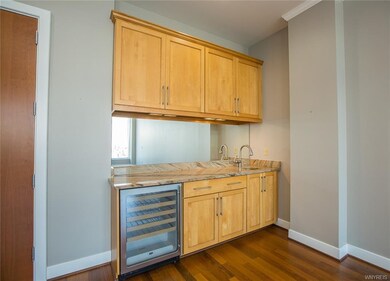 Wet bar with wine chiller and lots of cabinets
