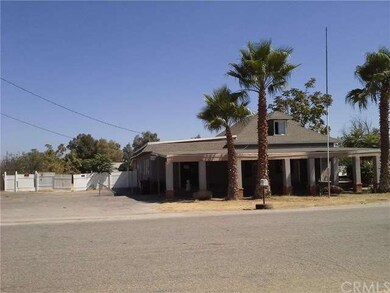FRONT OF HOME WITH PARKING AND  COVERED CARPORT  I