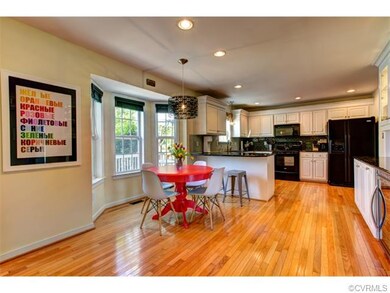 Eat in kitchen with bright bay window and recessed