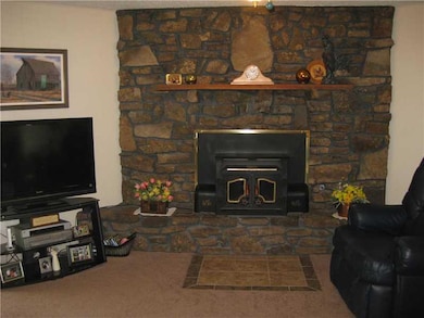 Den/Family/Great Room. Very nice wood burning fireplace insert in this warm and inviting family room.