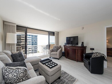 Living room featuring light wood-style flooring and expansive windows