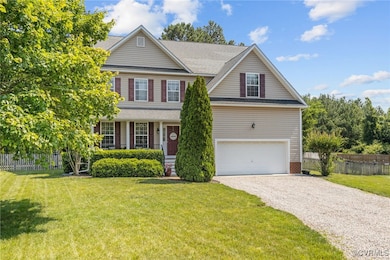 Traditional-style home with gravel driveway, an at
