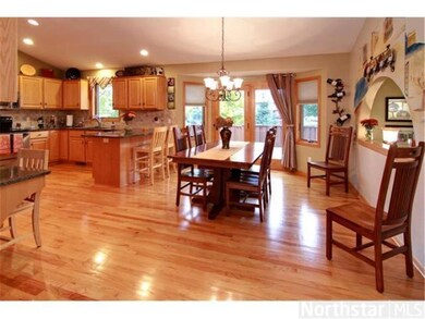 Huge kitchen/dining area with gleaming hardwood fl