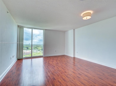 SPACIOUS LIVING AND DINING AREA WITH WOOD FLOORS