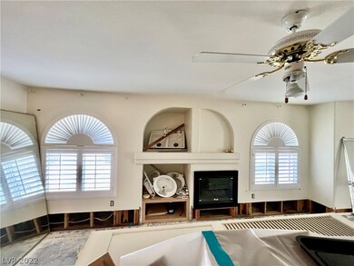 Open living room with tons of natural light, shutt
