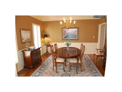 Formal Dining Room with Hardwood Floor, Crown Mold