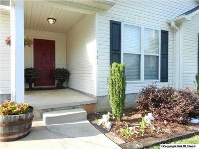 Nice landscaping and covered porch makes a great entryway.