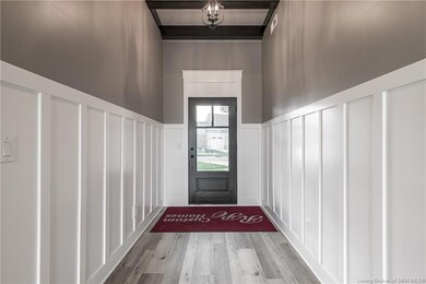 Inviting entry featuring board and batten trim, 11