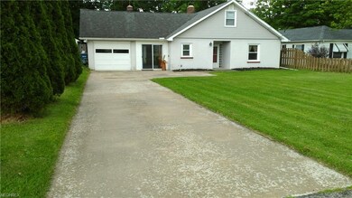 Concrete driveway with french drain.