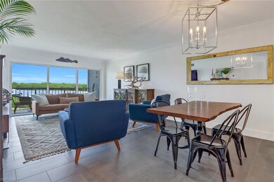 Dining space featuring a water view, tile patterne