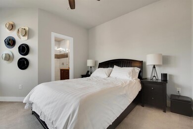 Serene Primary Bedroom – Spacious and bright with neutral tones, plush carpet, and a calm, modern feel—your perfect retreat after a long day.